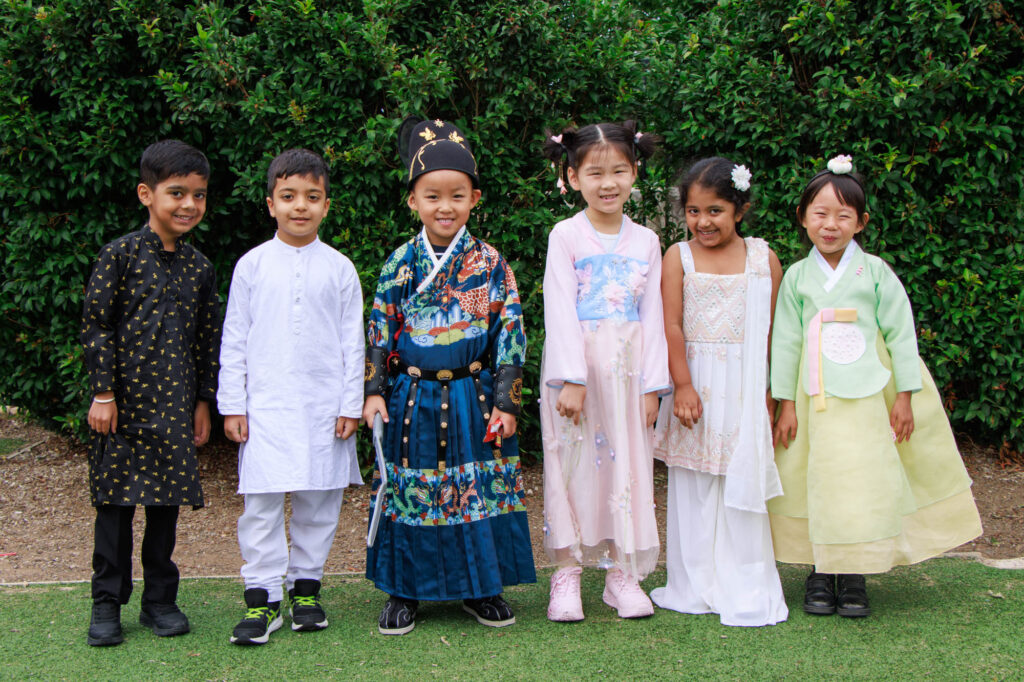 six junior students wearing cultural dress for harmony day